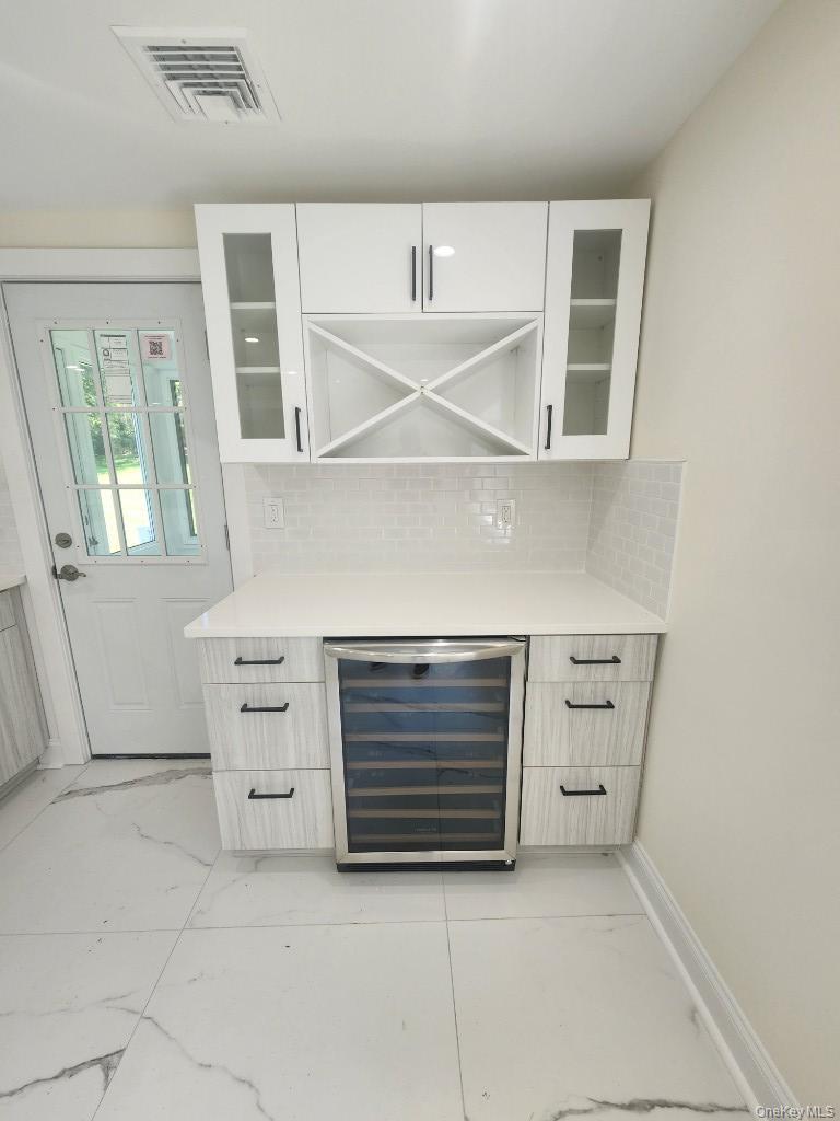 20 North Ravine Road Kings Point, NY 11023 - Photo 14 of 49 a view of an empty room with a fireplace