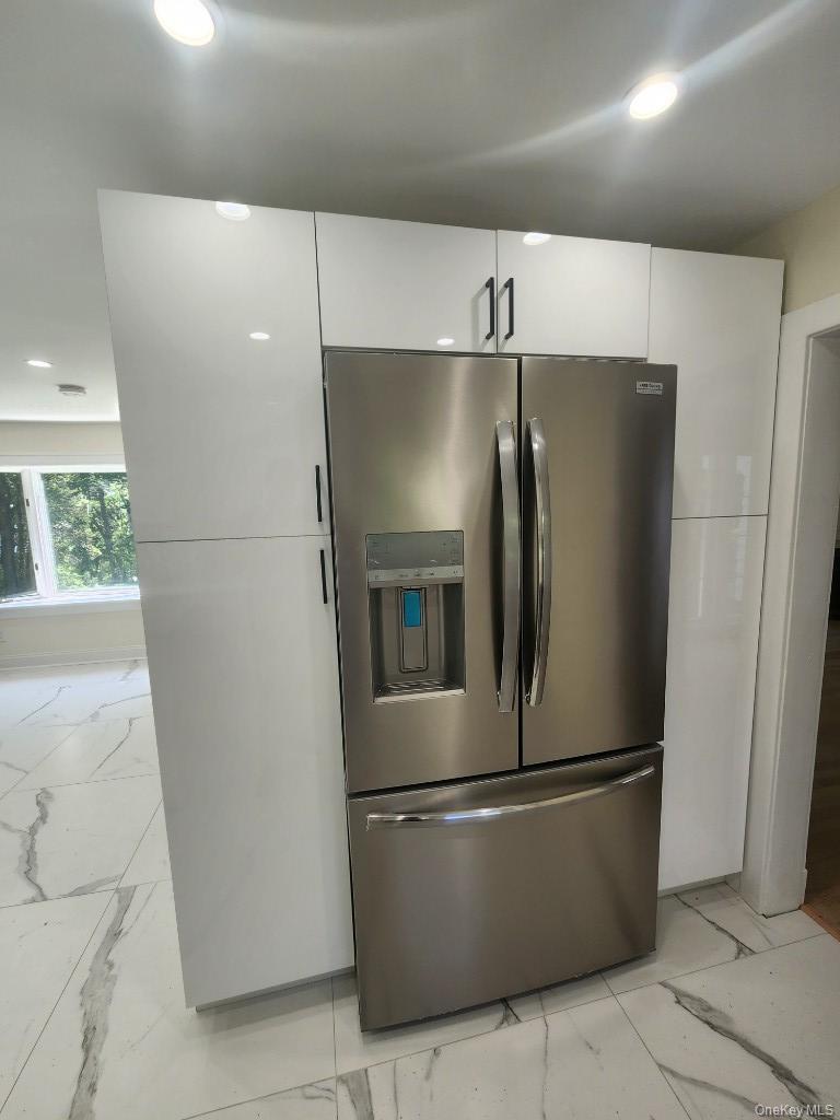 20 North Ravine Road Kings Point, NY 11023 - Photo 16 of 49 a refrigerator freezer sitting inside of a kitchen