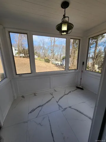 a view of an empty room with a window