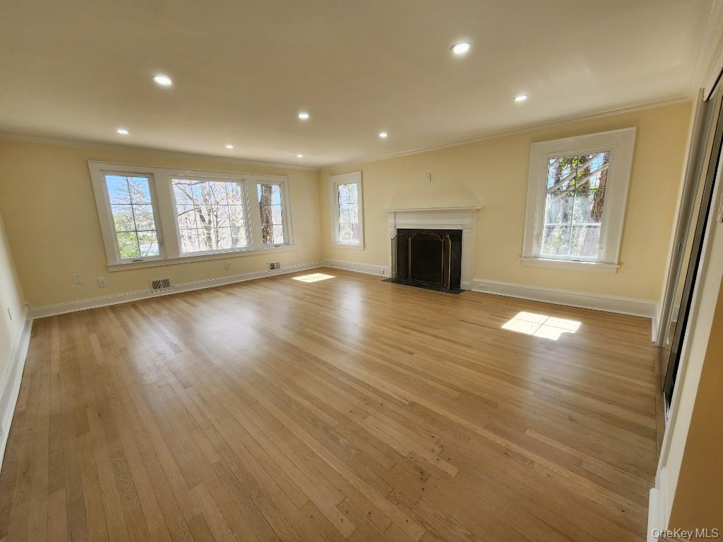 20 North Ravine Road Kings Point, NY 11023 - Photo 19 of 49 an empty room with wooden floor and windows