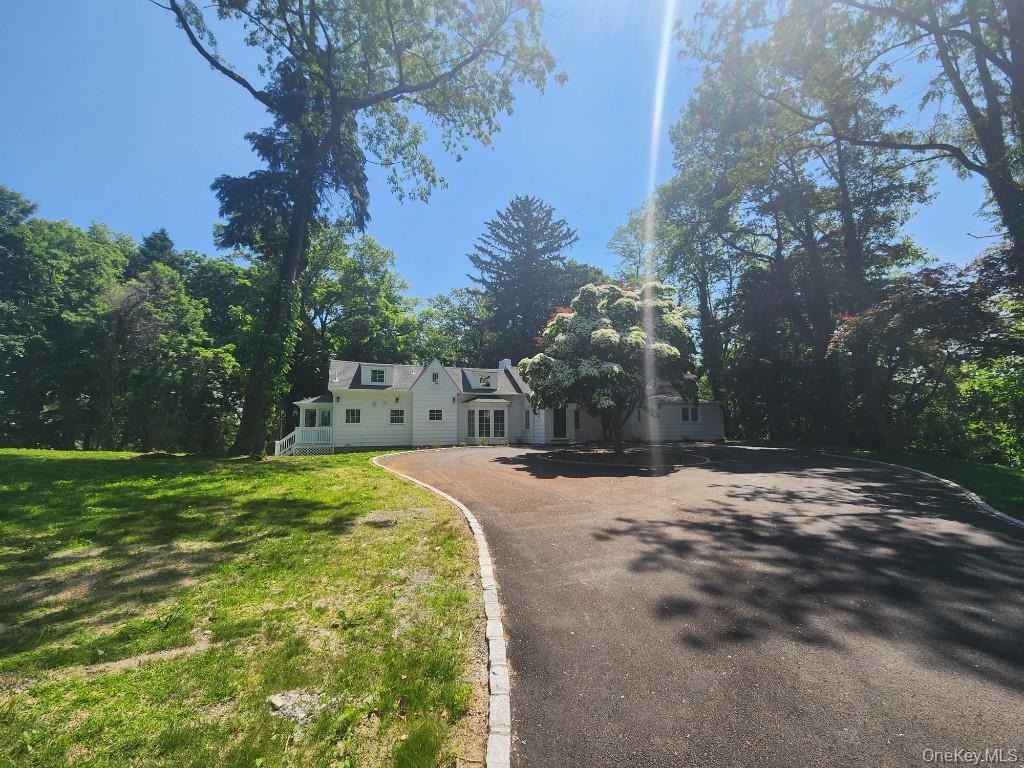 20 North Ravine Road Kings Point, NY 11023 - Photo 2 of 49 a view of a yard with plants and trees