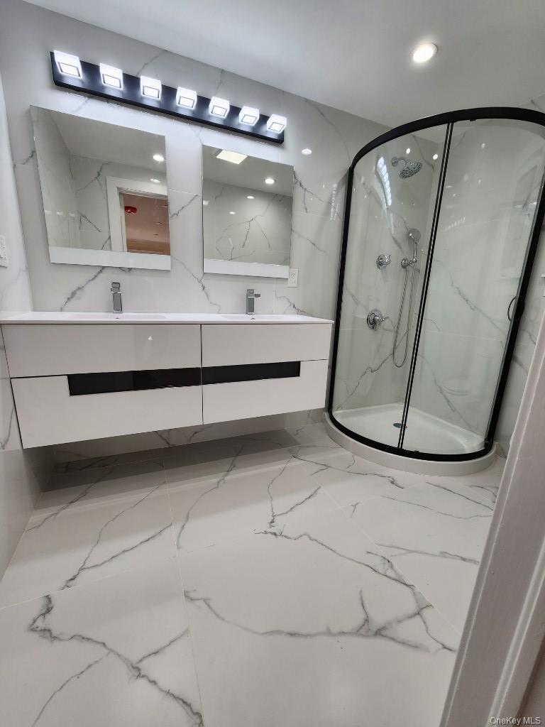 20 North Ravine Road Kings Point, NY 11023 - Photo 21 of 49 a bathroom with a sink mirror and vanity