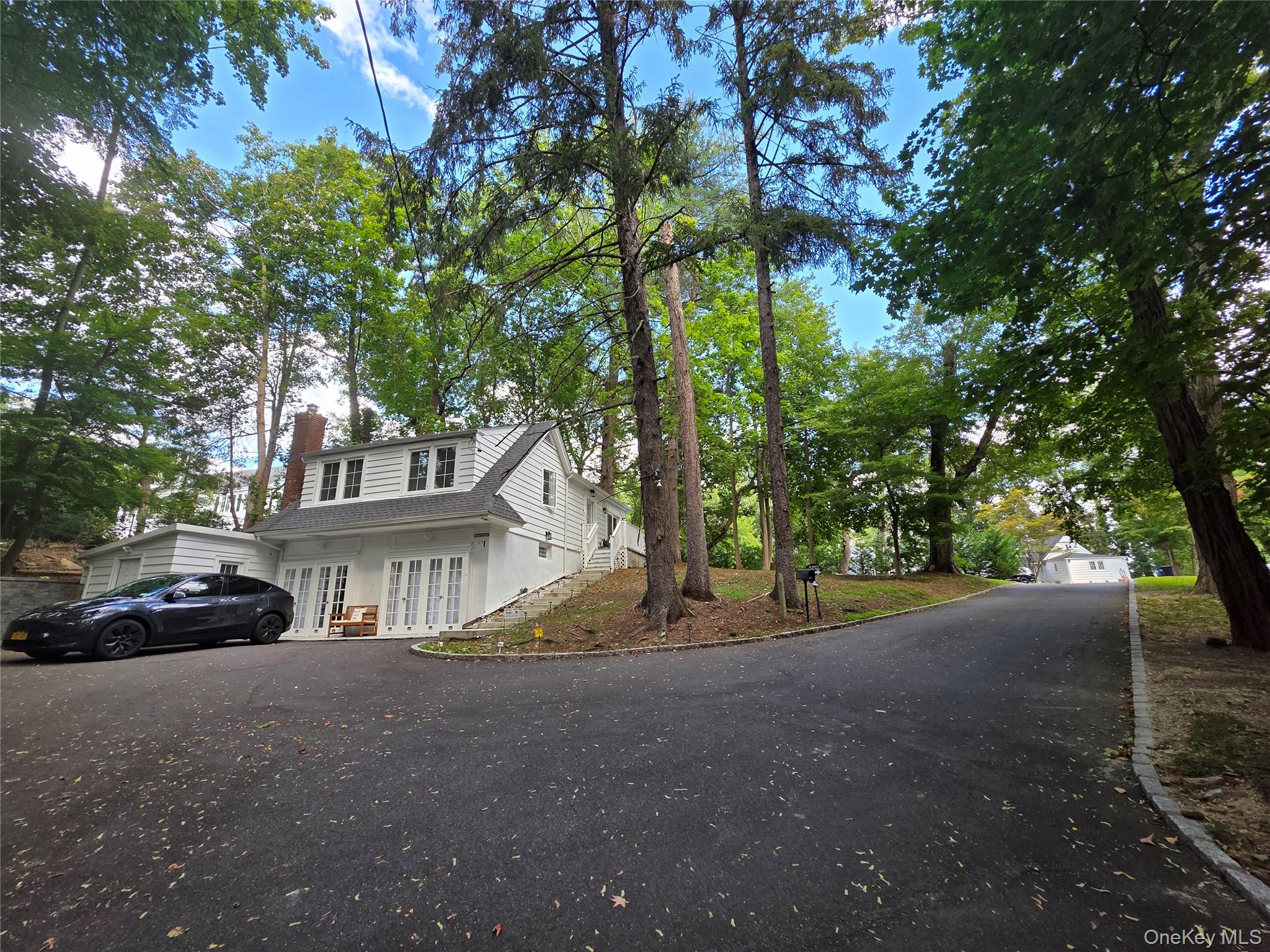 20 North Ravine Road Kings Point, NY 11023 - Photo 39 of 49 a view of a street with a parked cars