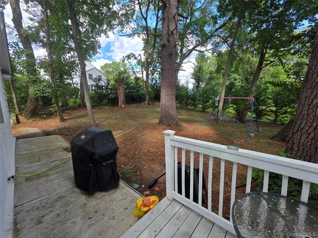 a view of a deck with a backyard