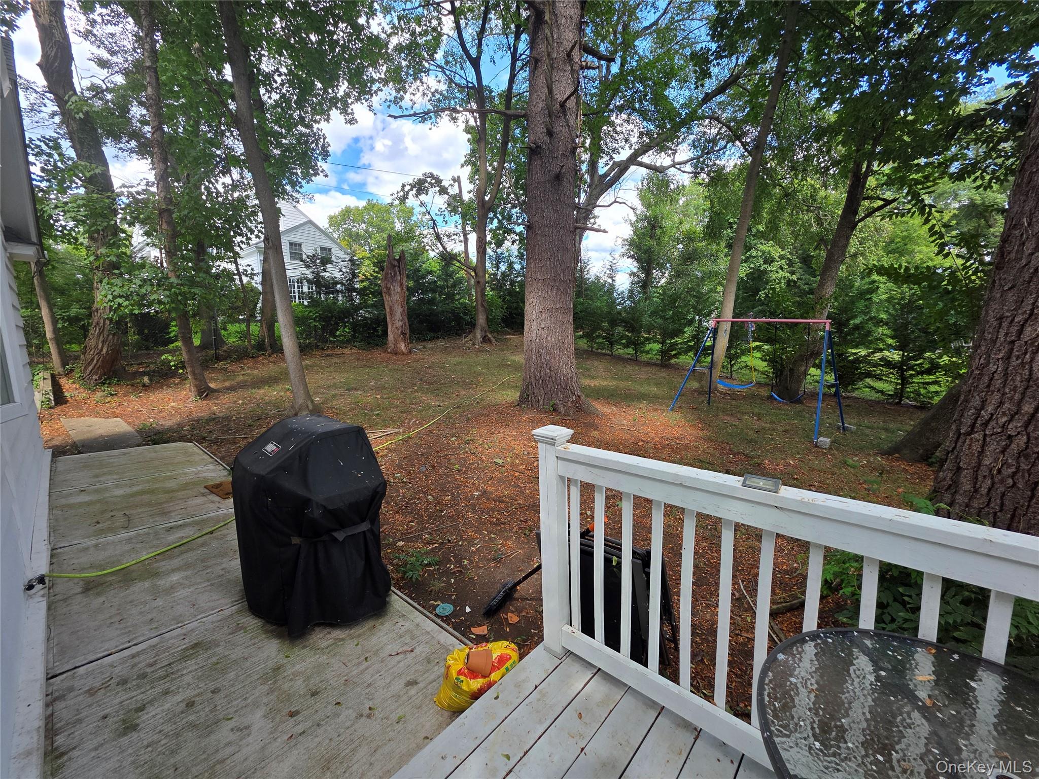 20 North Ravine Road Kings Point, NY 11023 - Photo 40 of 49 a view of a deck with a backyard