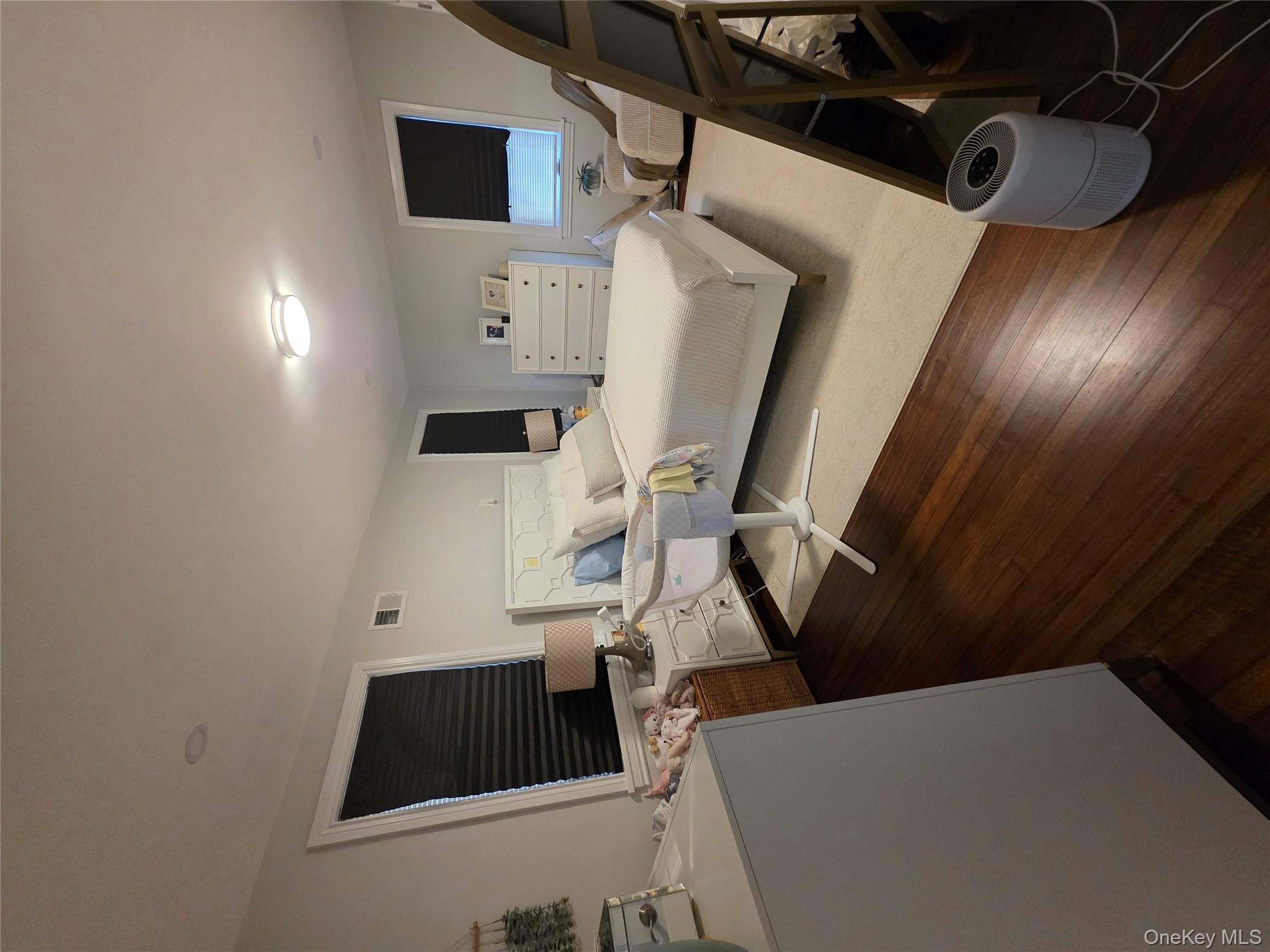 20 North Ravine Road Kings Point, NY 11023 - Photo 44 of 49 a bedroom with furniture and a flat screen tv