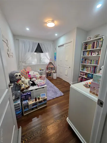a room with furniture and gym equipment