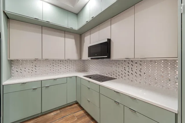a kitchen with stainless steel appliances granite countertop a sink stove and wooden floor