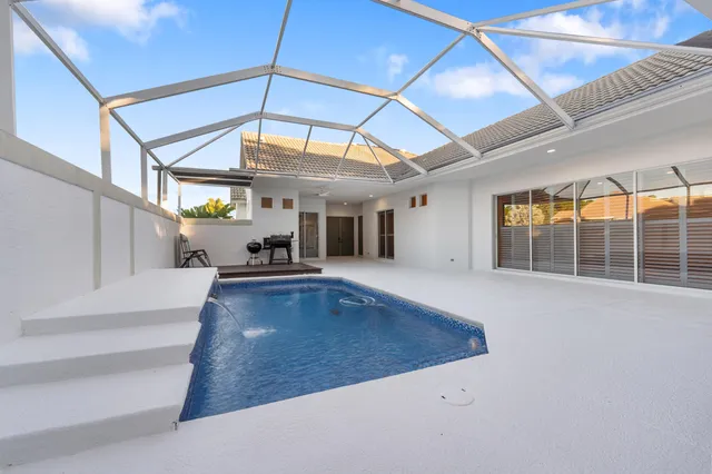 a view of an empty room with wooden walls