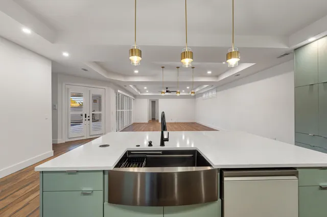 a kitchen with a sink and cabinets