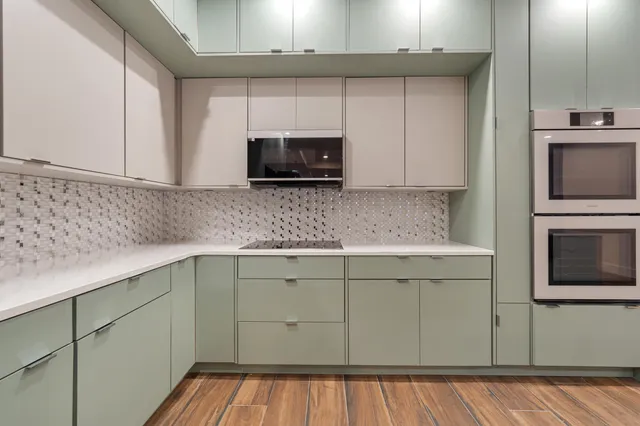 a kitchen with a sink and cabinets