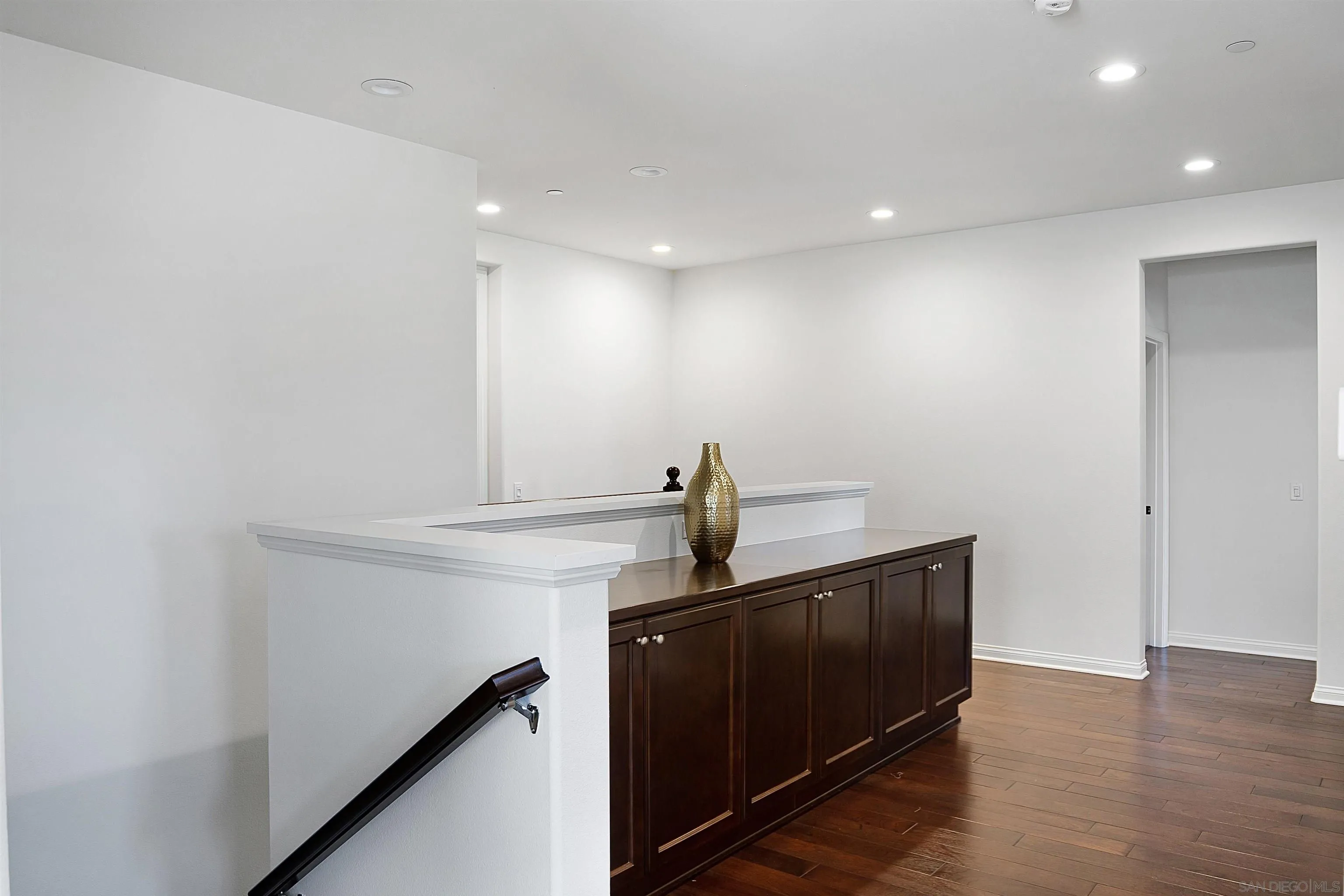 15901 Sarah Ridge Road San Diego, CA 92127 - Photo 12 of 34 a view of hallway with stairs and wooden floor