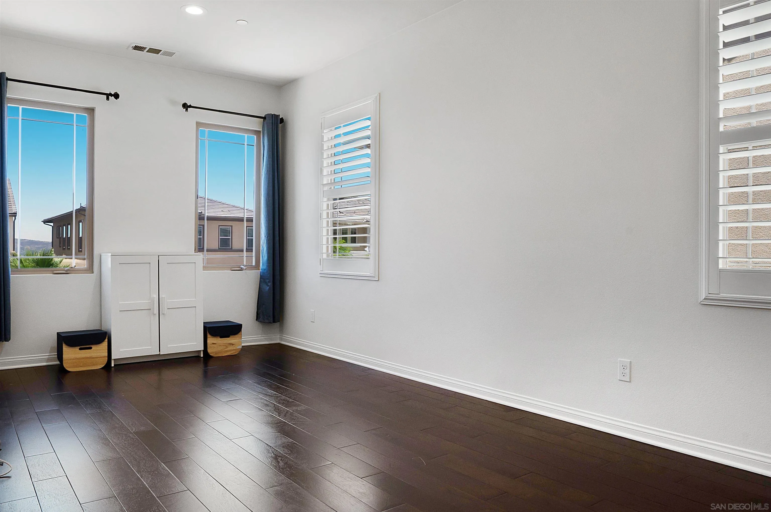 15901 Sarah Ridge Road San Diego, CA 92127 - Photo 13 of 34 an empty room with wooden floor and windows