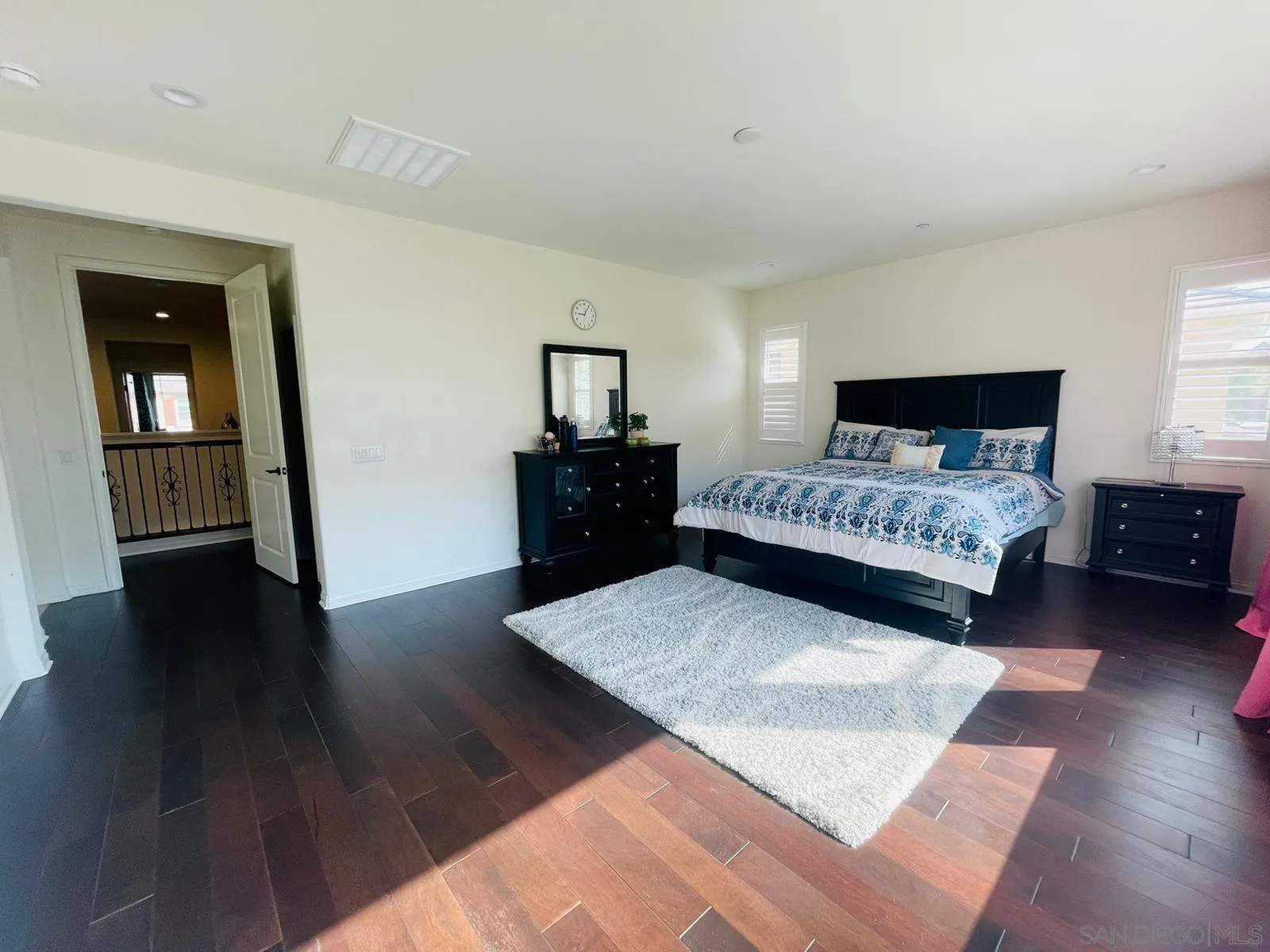 15901 Sarah Ridge Road San Diego, CA 92127 - Photo 14 of 34 a bedroom with a bed and wooden floor