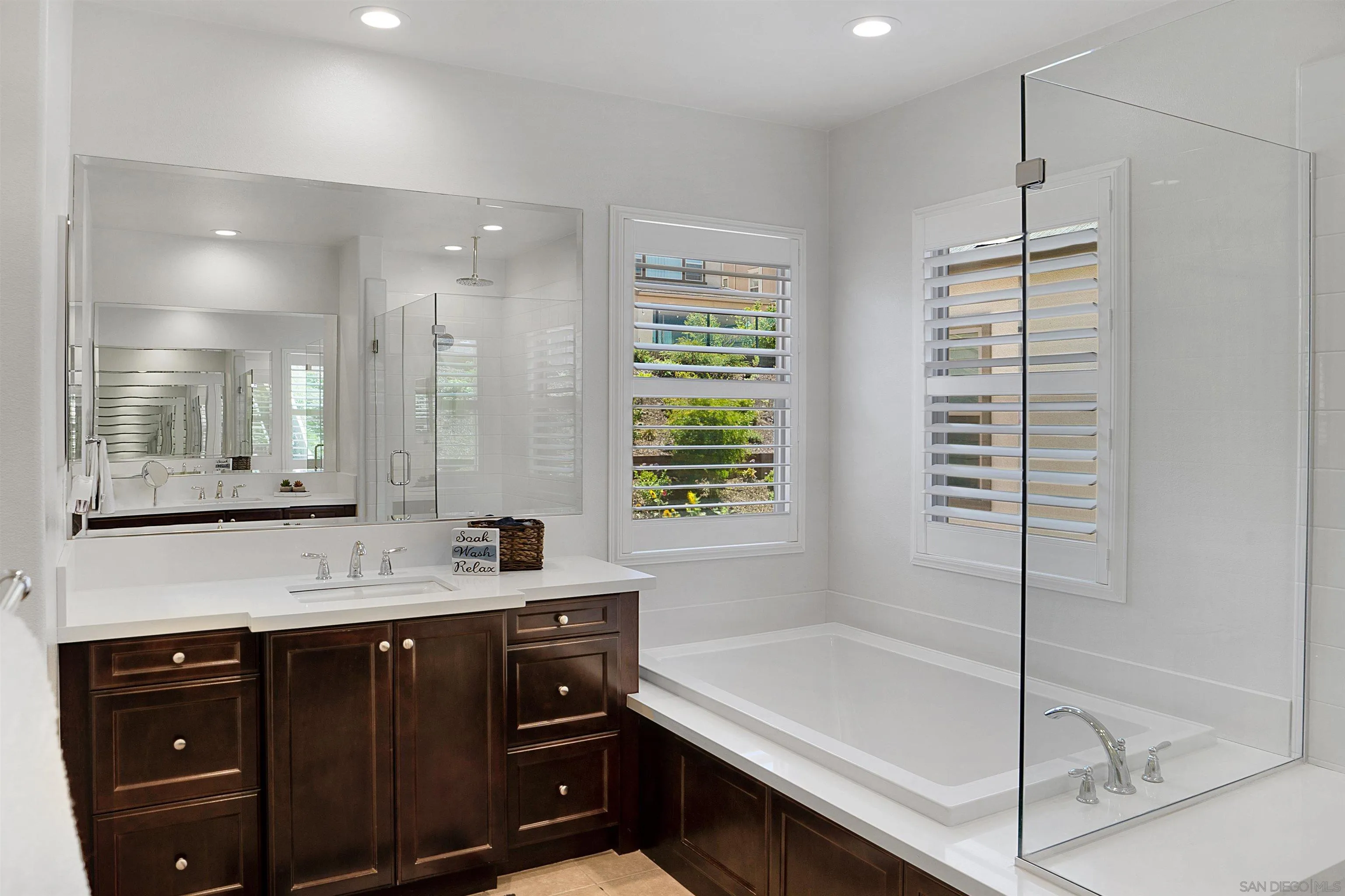 15901 Sarah Ridge Road San Diego, CA 92127 - Photo 19 of 34 a bathroom with a tub sink and mirror