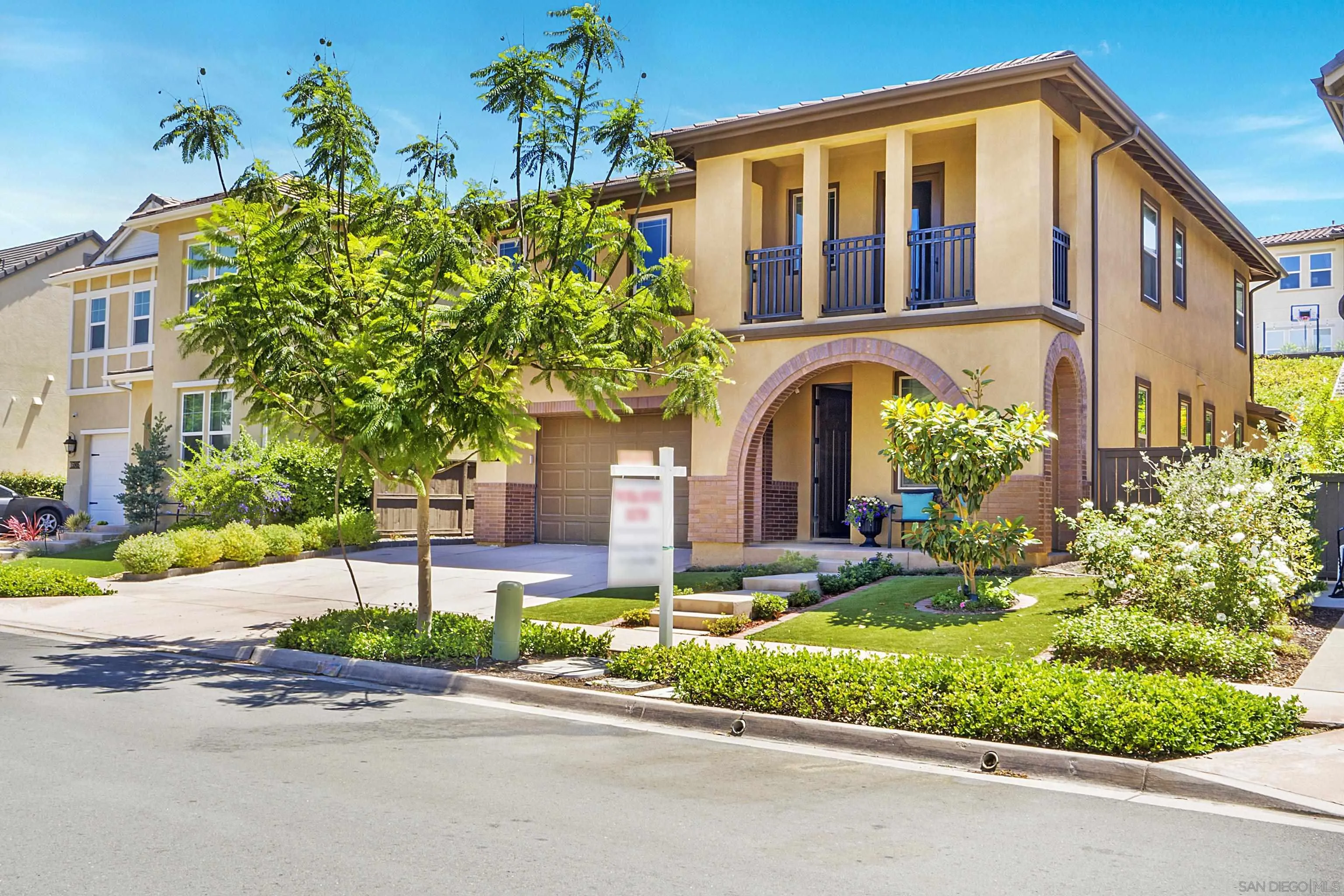 15901 Sarah Ridge Road San Diego, CA 92127 - Photo 2 of 34 a front view of a house with a yard and potted plants