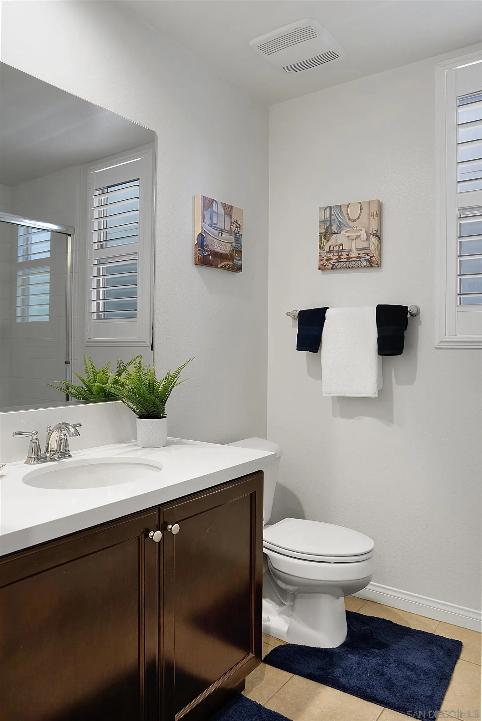 15901 Sarah Ridge Road San Diego, CA 92127 - Photo 24 of 34 a bathroom with a toilet sink and mirror