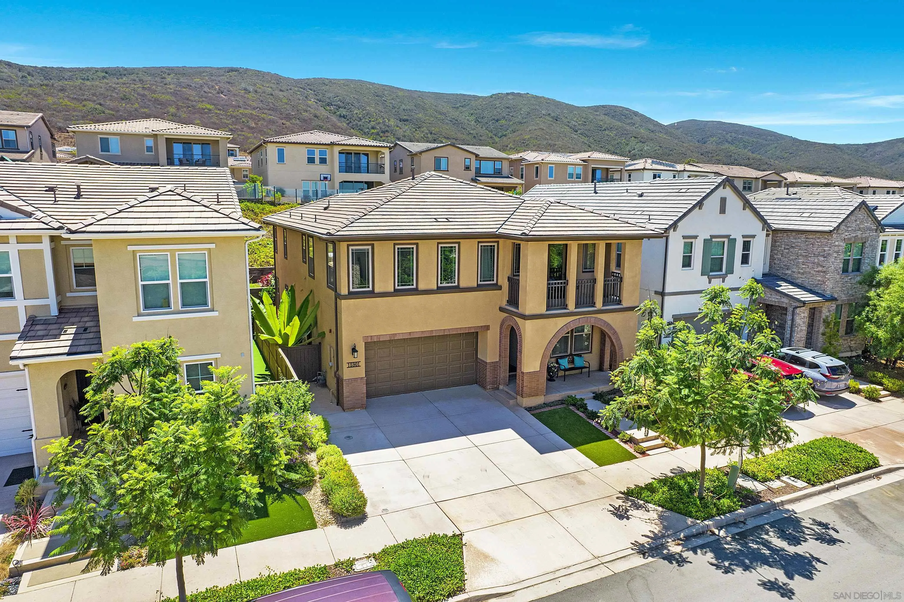 15901 Sarah Ridge Road San Diego, CA 92127 - Photo 29 of 34 a front view of a house with a garden