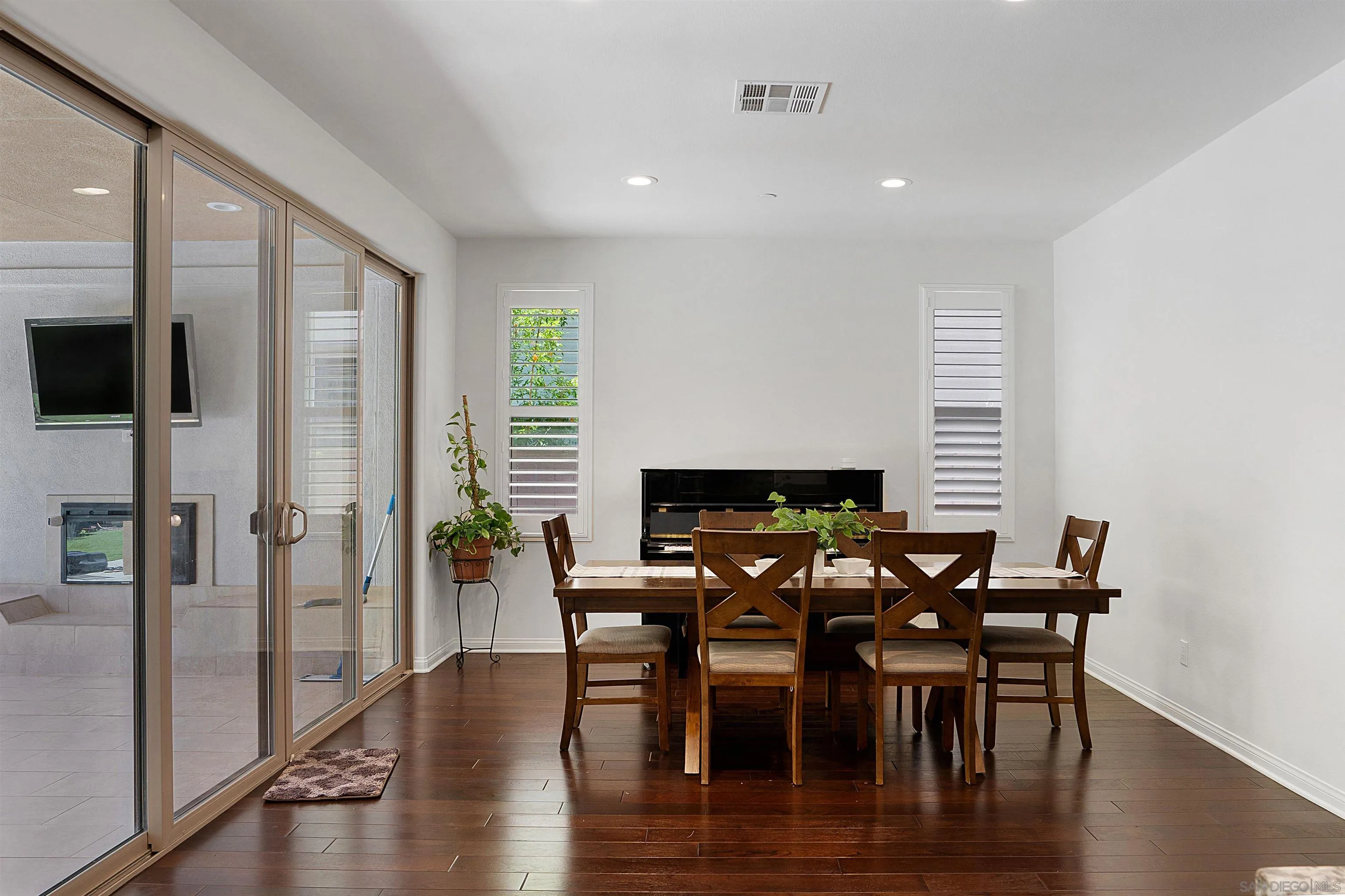 15901 Sarah Ridge Road San Diego, CA 92127 - Photo 9 of 34 a view of a dining room with furniture window and wooden floor