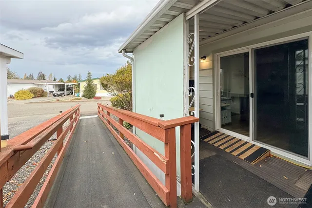 a view of a patio with table and chairs