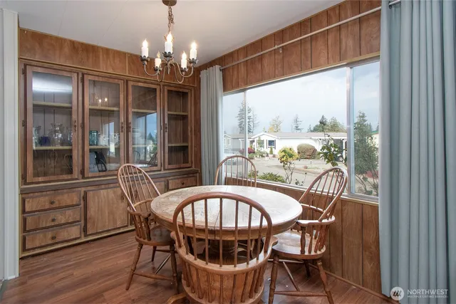 a view of a dining room with furniture window and outside view