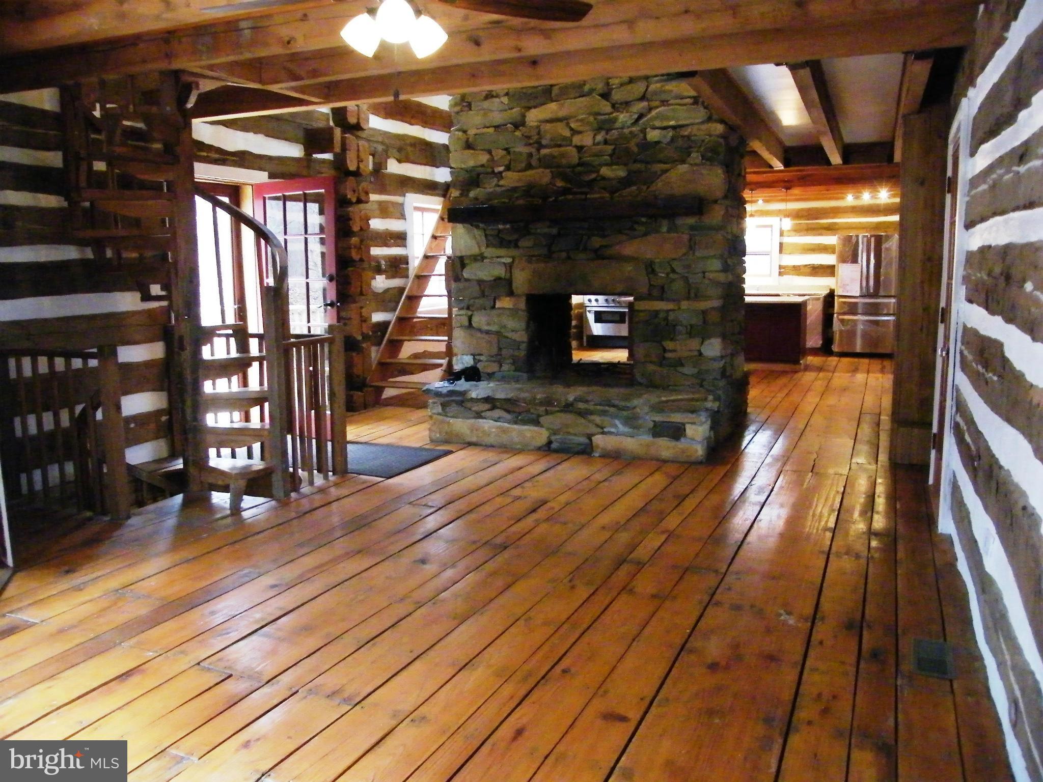 13261 Wilt Store Road Leesburg, VA 20176 - Photo 10 of 30 Living Room- note: 2 sided 2 story Stone Fireplace