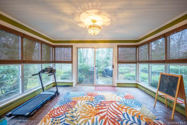 10 Hidden Pond Muttontown, NY 11545 - Photo 12 of 46 a bedroom with furniture and large windows