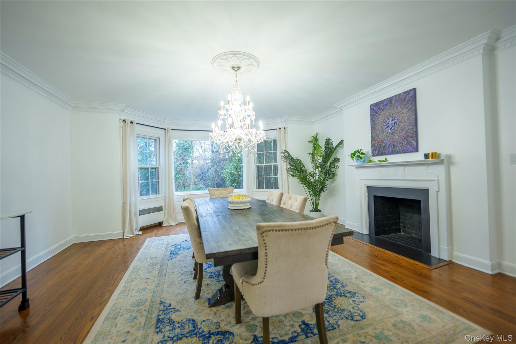 10 Hidden Pond Muttontown, NY 11545 - Photo 13 of 46 a view of a dining room with furniture window and wooden floor