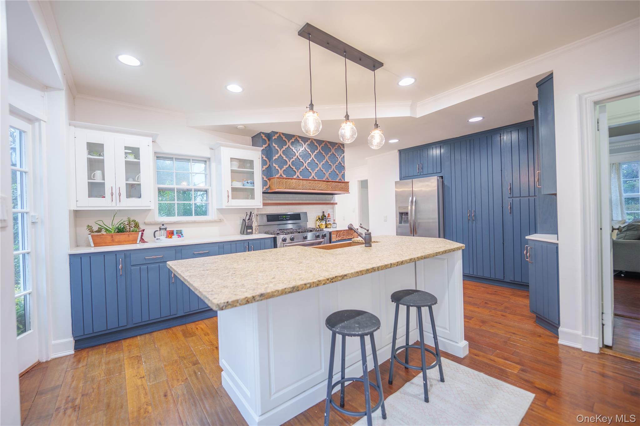 10 Hidden Pond Muttontown, NY 11545 - Photo 15 of 46 a large kitchen with a table and chairs