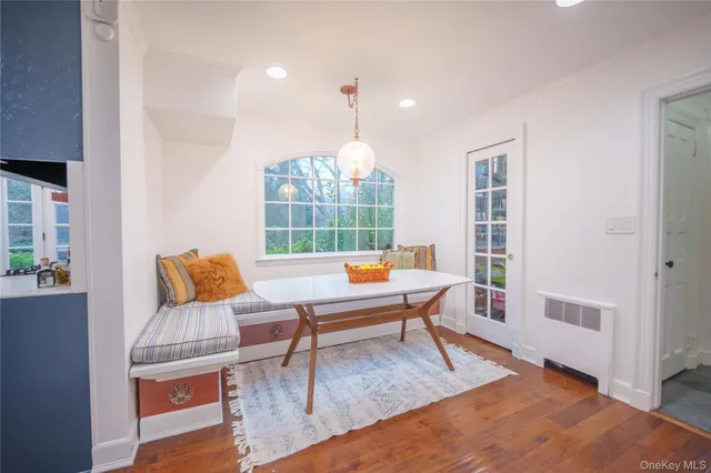 a living room with furniture a window and a table