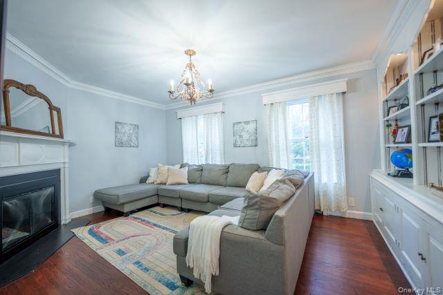 10 Hidden Pond Muttontown, NY 11545 - Photo 21 of 46 a living room with furniture and a fireplace