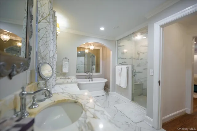 a bathroom with a granite countertop sink mirror and shower