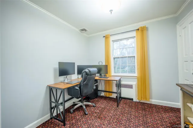 a workspace with furniture and a window