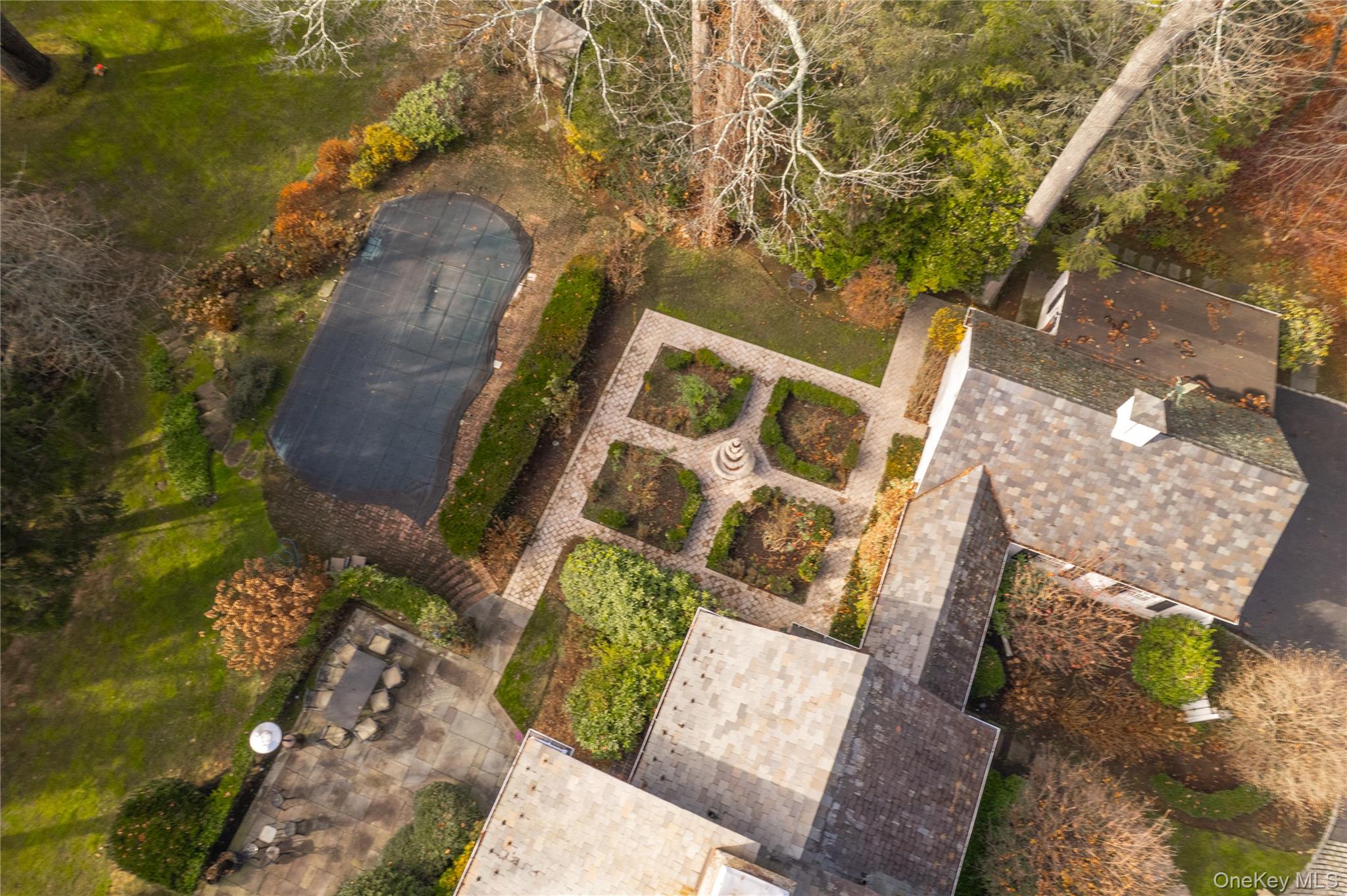 10 Hidden Pond Muttontown, NY 11545 - Photo 46 of 46 an aerial view of a house with a yard and wooden fence