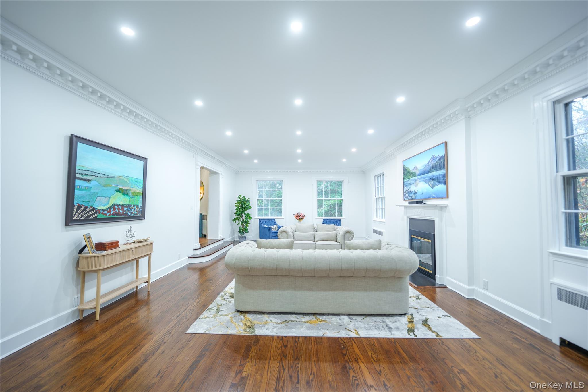 10 Hidden Pond Muttontown, NY 11545 - Photo 9 of 46 a living room with furniture and a wooden floor