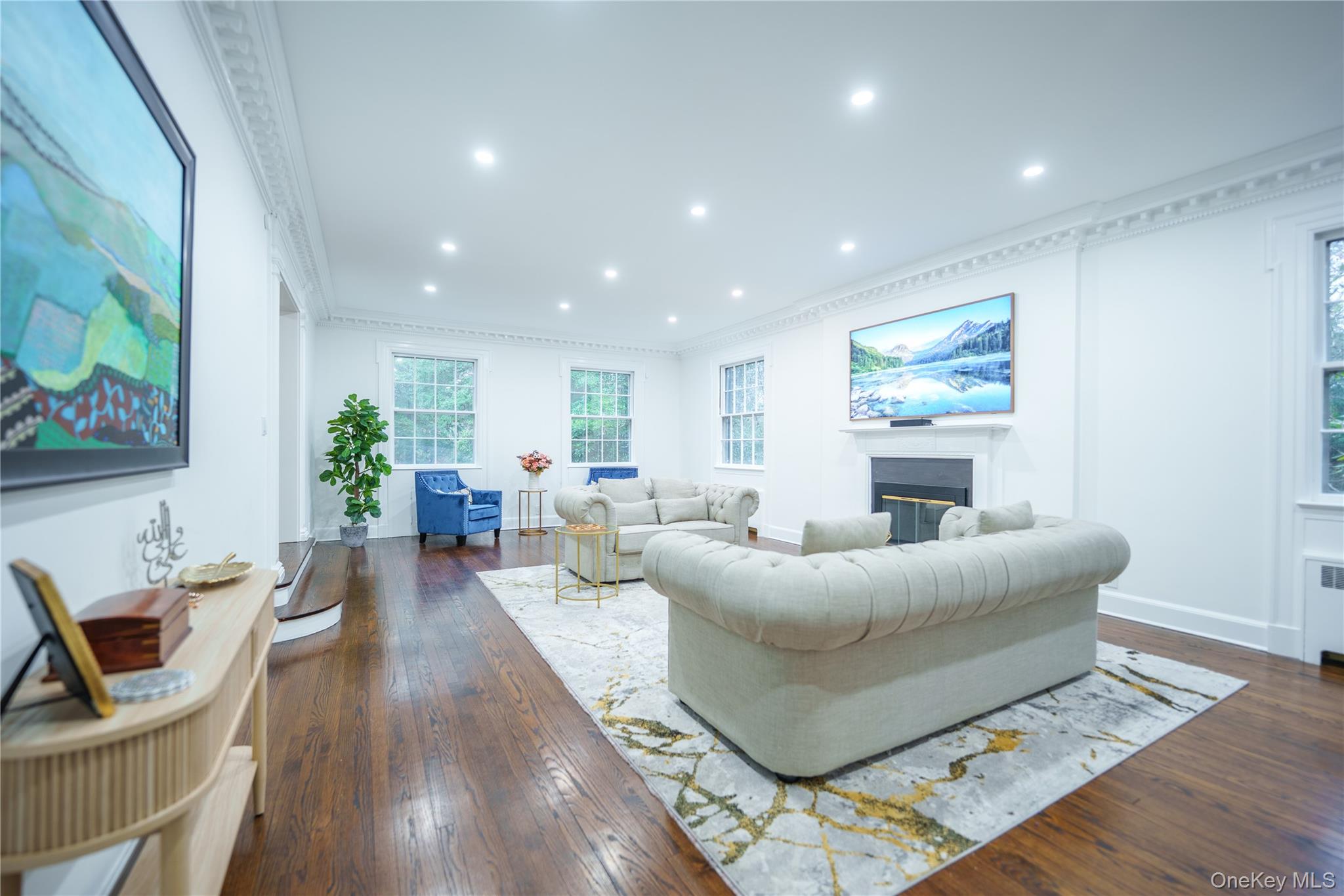10 Hidden Pond Muttontown, NY 11545 - Photo 10 of 46 a living room with furniture and a flat screen tv