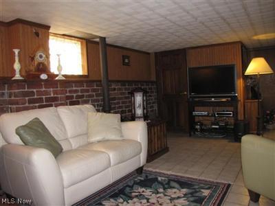 1548 Sheffield Road South Euclid, OH 44121 - Photo 19 of 25 Comfortable rec room with half bath and plenty of storage!
