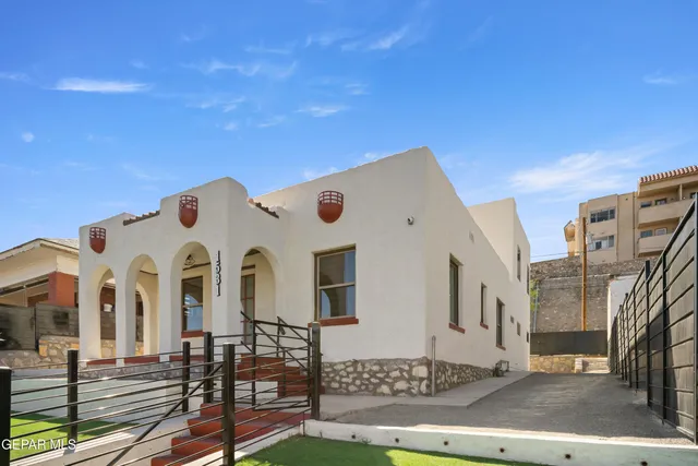 a front view of a building with many windows