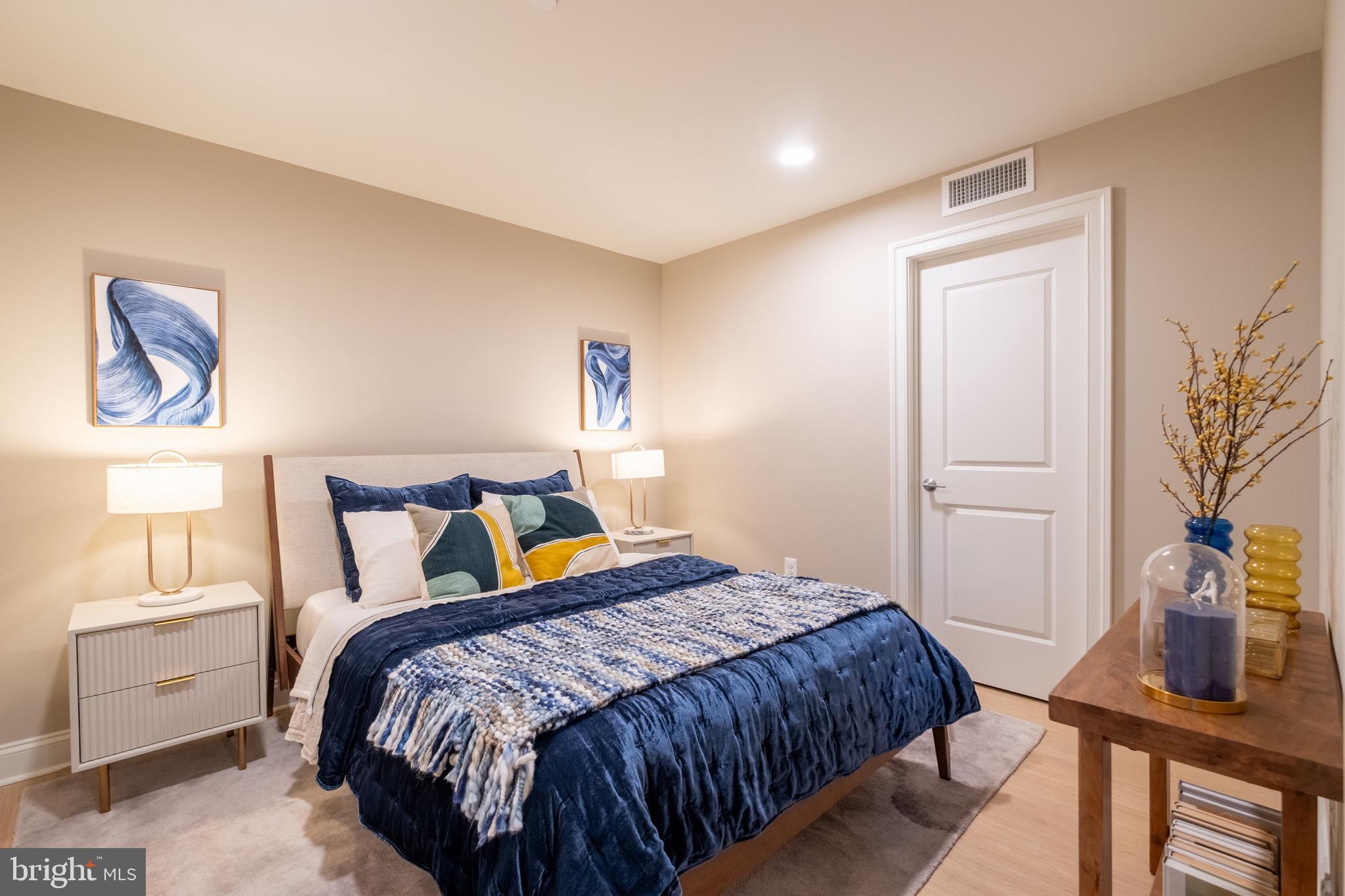 2301-61 John F Kennedy Boulevard, Unit 201 Philadelphia, PA 19103 - Photo 13 of 36 a bedroom with a bed and a window