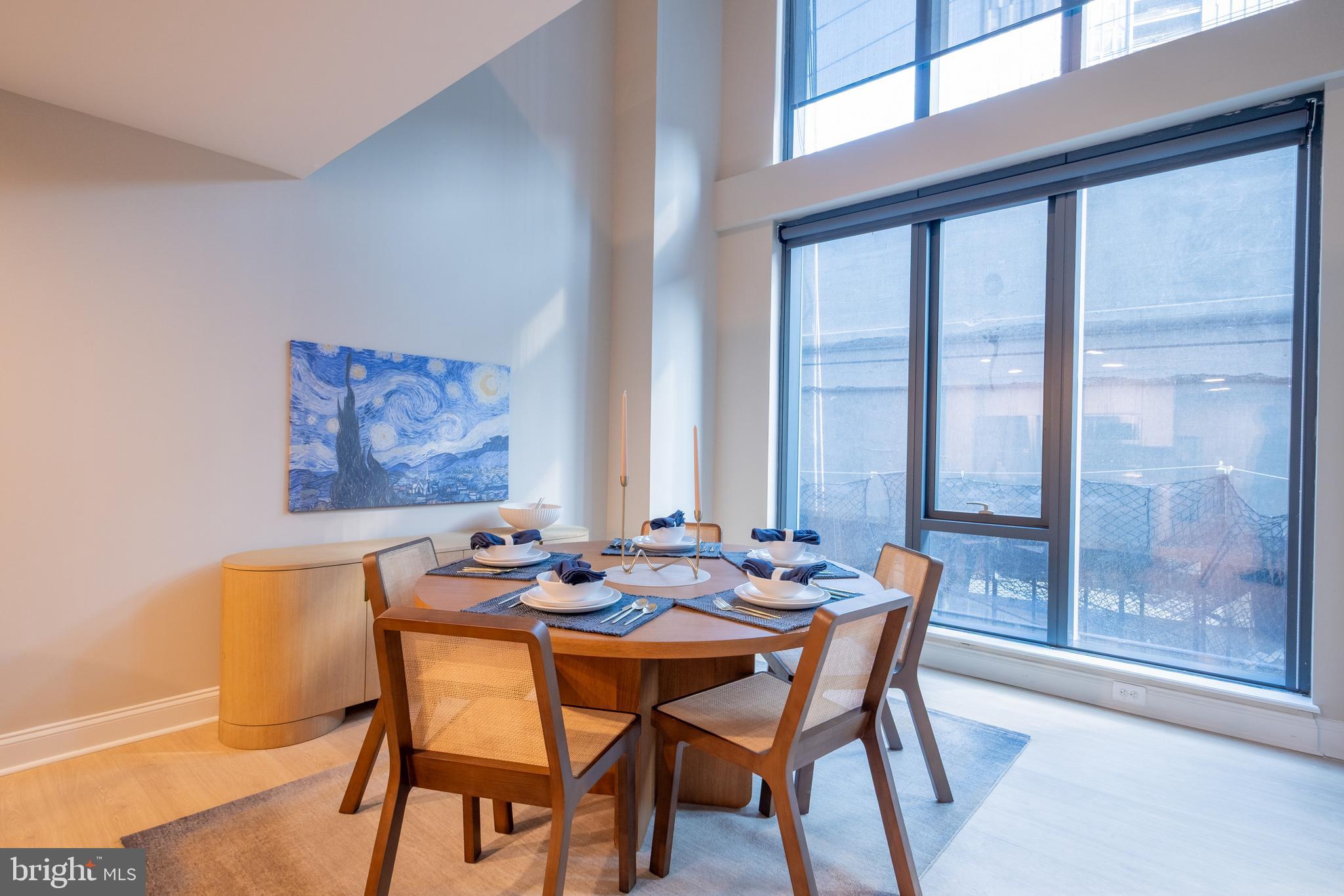 2301-61 John F Kennedy Boulevard, Unit 201 Philadelphia, PA 19103 - Photo 30 of 36 a dining room with furniture and window