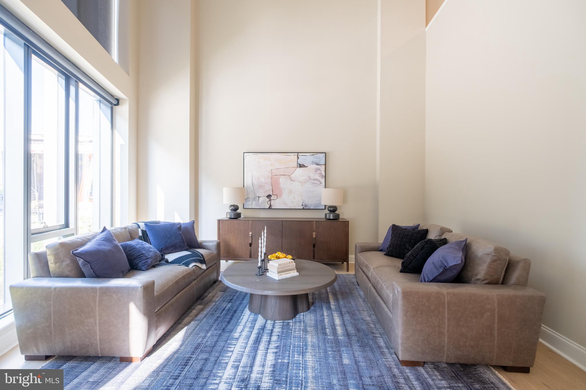 2301-61 John F Kennedy Boulevard, Unit 201 Philadelphia, PA 19103 - Photo 7 of 36 a living room with furniture and a large window
