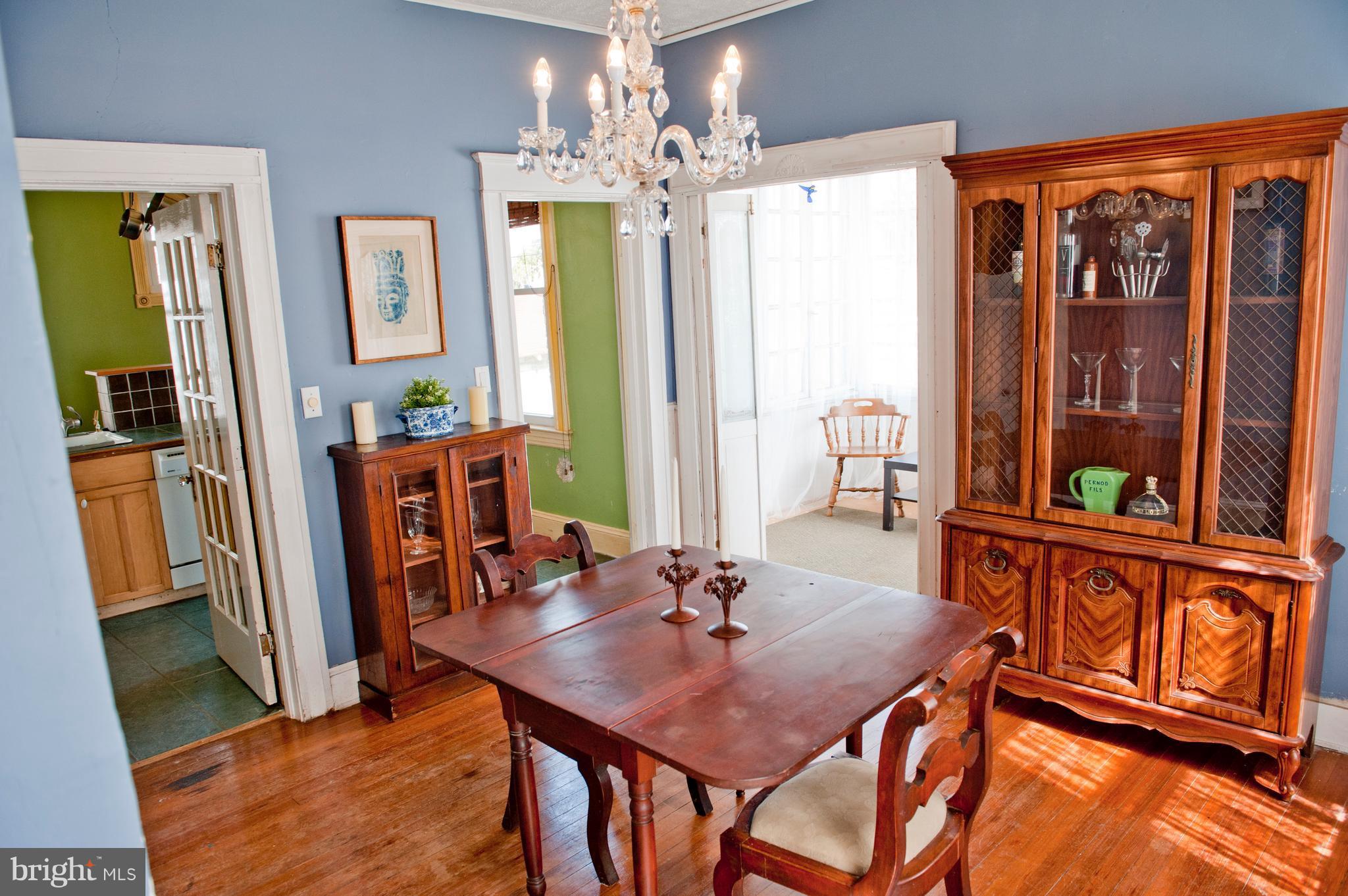 6105 York Road Baltimore, MD 21212 - Photo 11 of 24 a view of a dining room with furniture and a chandelier