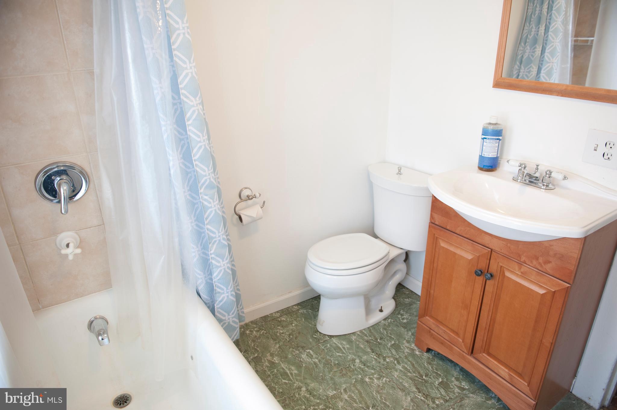 6105 York Road Baltimore, MD 21212 - Photo 19 of 24 a white toilet sitting next to a white sink