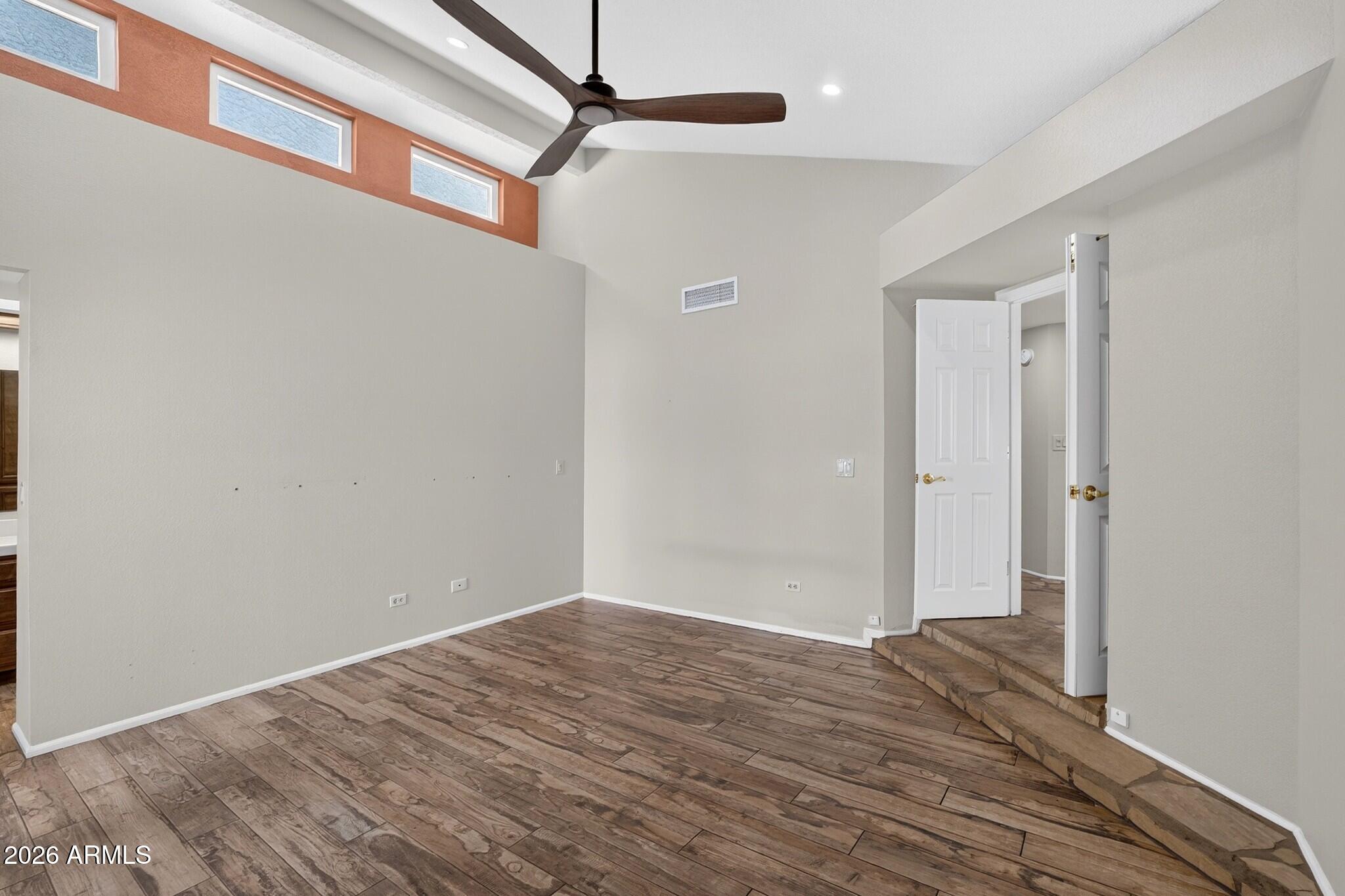 4615 East Monte Way Phoenix, AZ 85044 - Photo 20 of 35 a view of a big room with wooden floor and windows