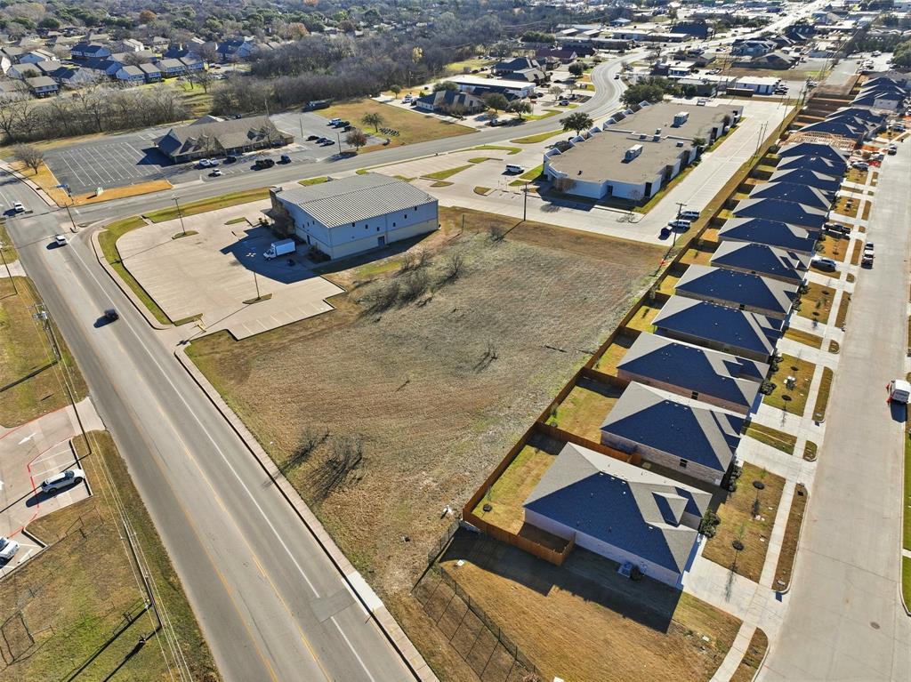 1007 Woodard Avenue Cleburne, TX 76033 - Photo 11 of 15 an aerial view of residential houses with outdoor space