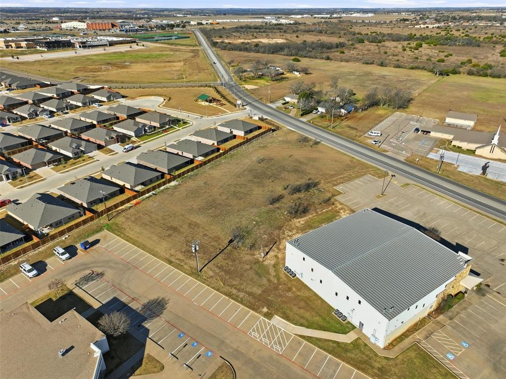 1007 Woodard Avenue Cleburne, TX 76033 - Photo 2 of 15 an aerial view of residential houses with outdoor space