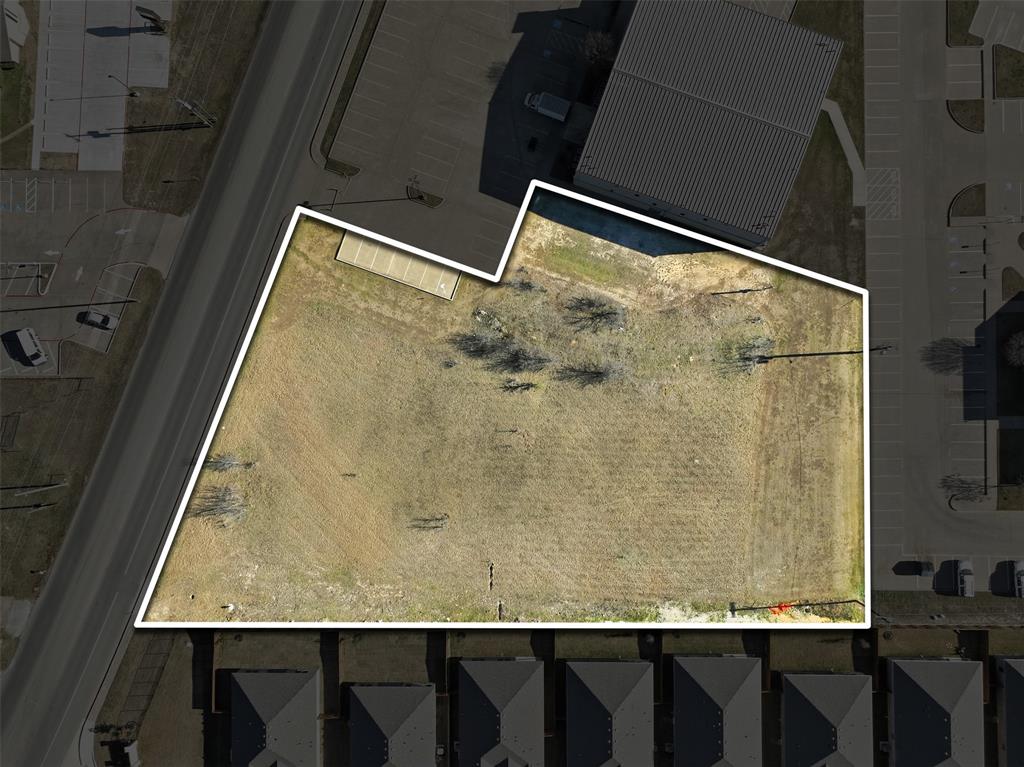 1007 Woodard Avenue Cleburne, TX 76033 - Photo 5 of 15 a bathroom with a granite countertop sink a mirror and shower