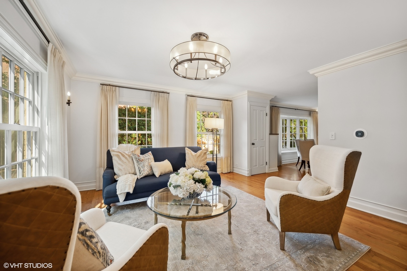 88 Abbotsford Road Winnetka, IL 60093 - Photo 12 of 46 a living room with furniture chandelier and a window