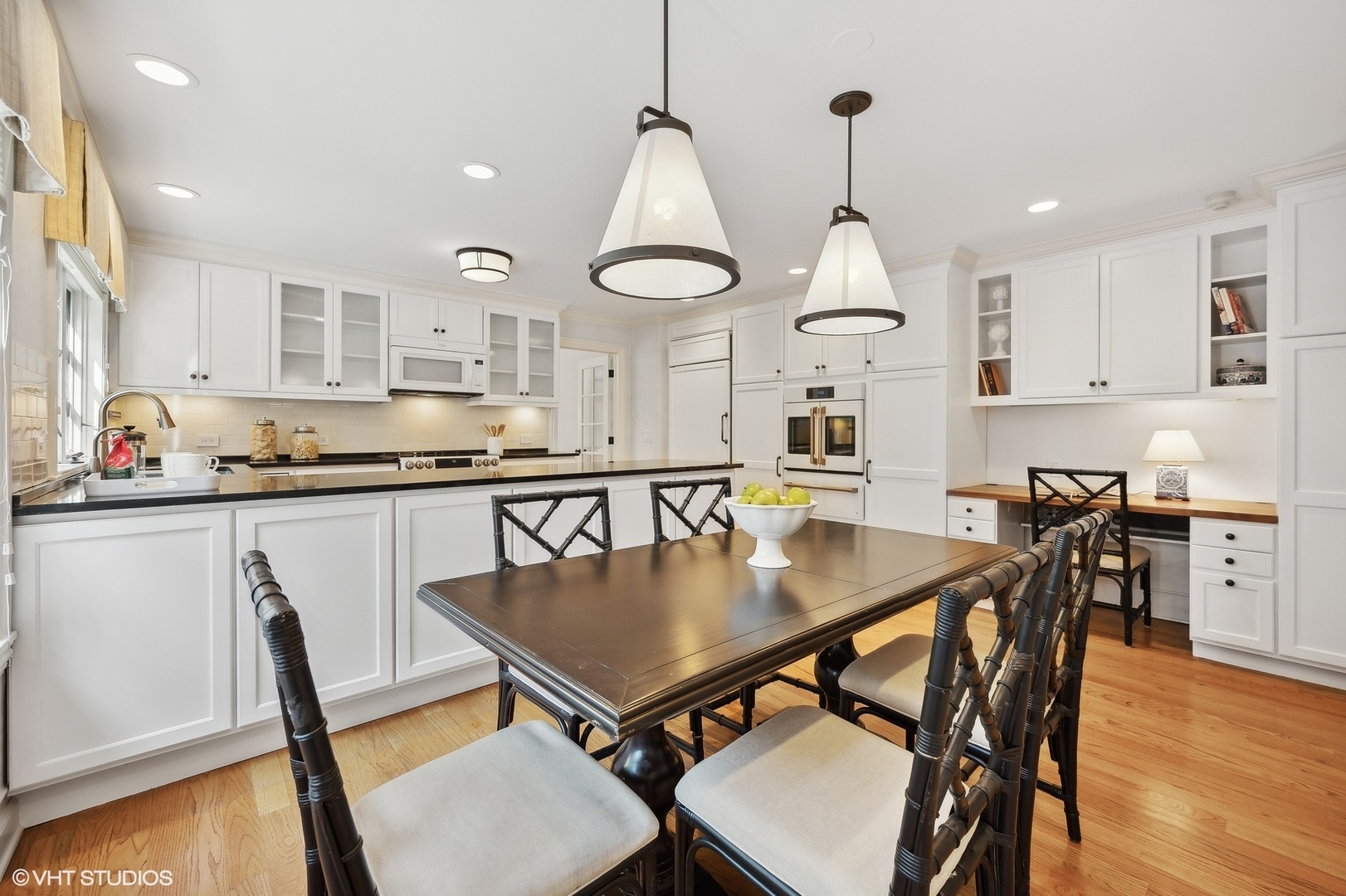 88 Abbotsford Road Winnetka, IL 60093 - Photo 19 of 46 a kitchen with a table and chairs in it