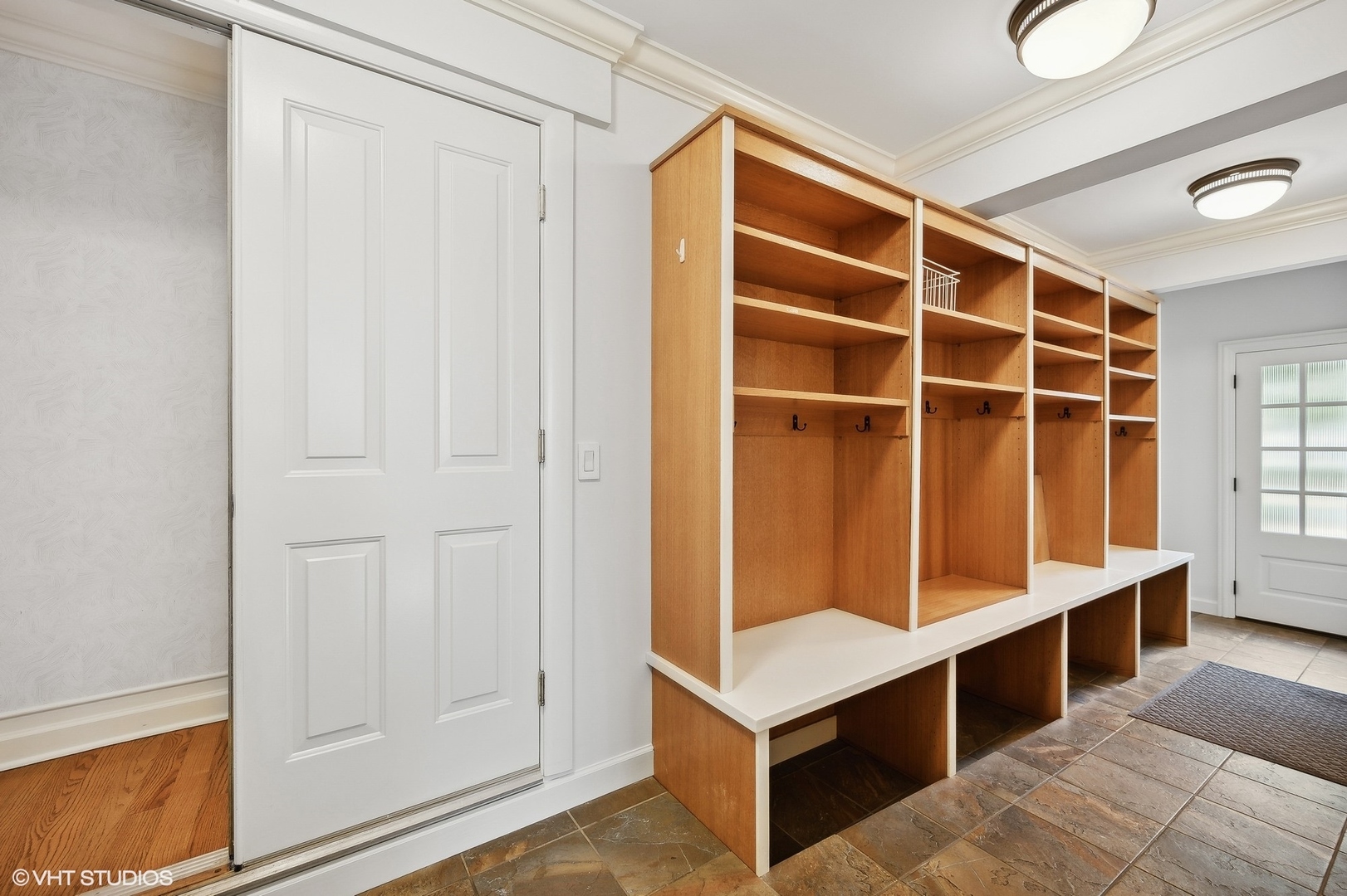 88 Abbotsford Road Winnetka, IL 60093 - Photo 27 of 46 a view of an empty room with wooden floor and cabinet
